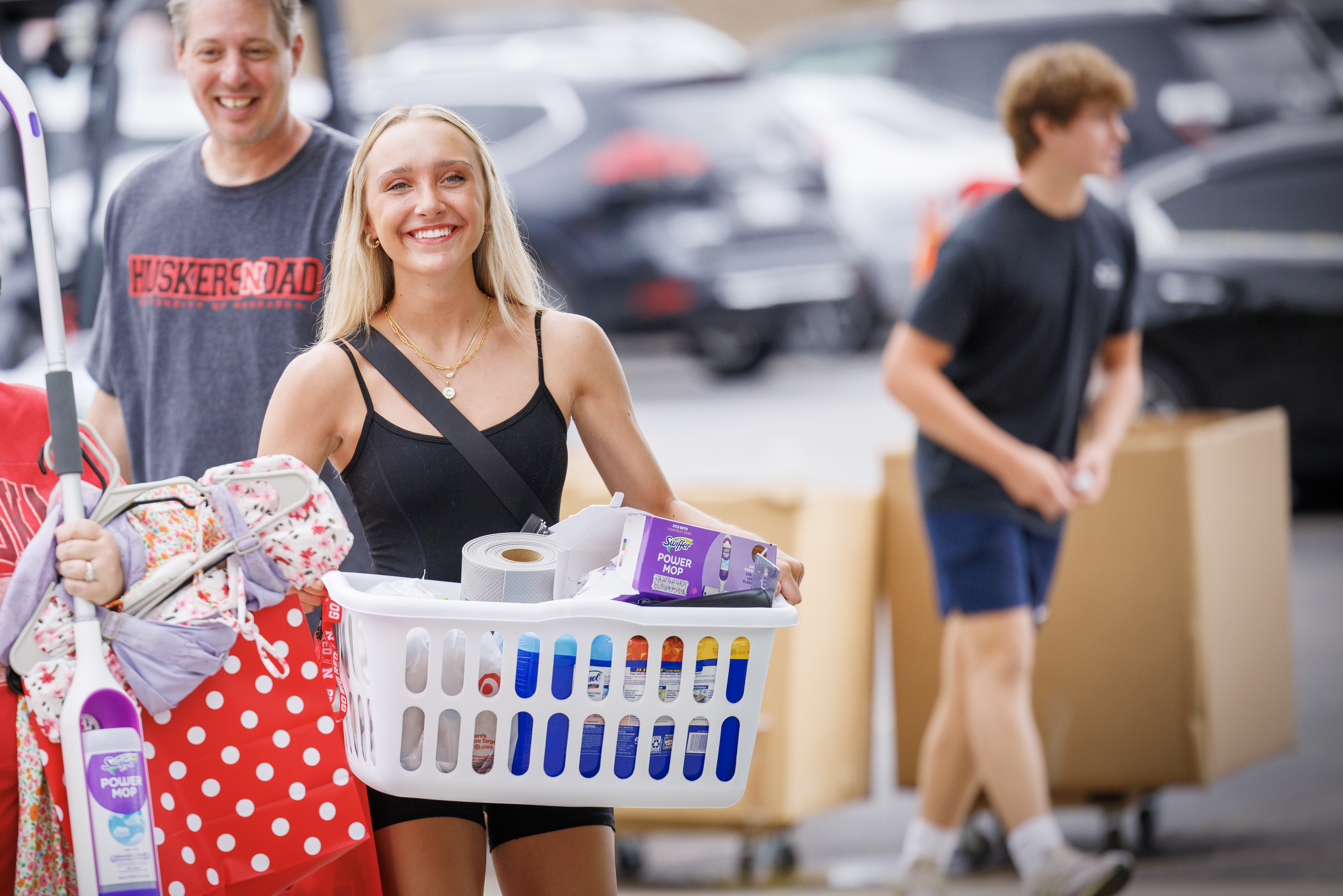 Student smiling as they move-in to their residence hall.