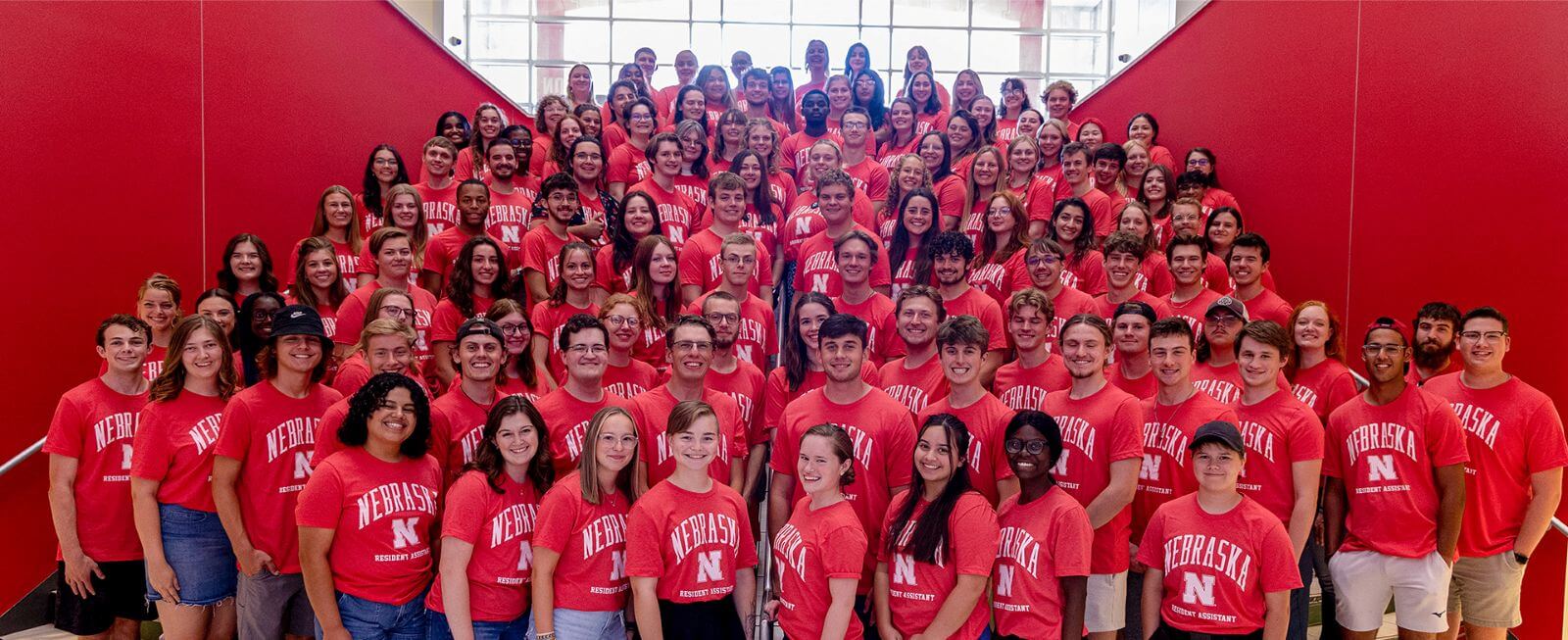 A group of resident assistants posing for a photograph at the Nebraska Union in 2023.