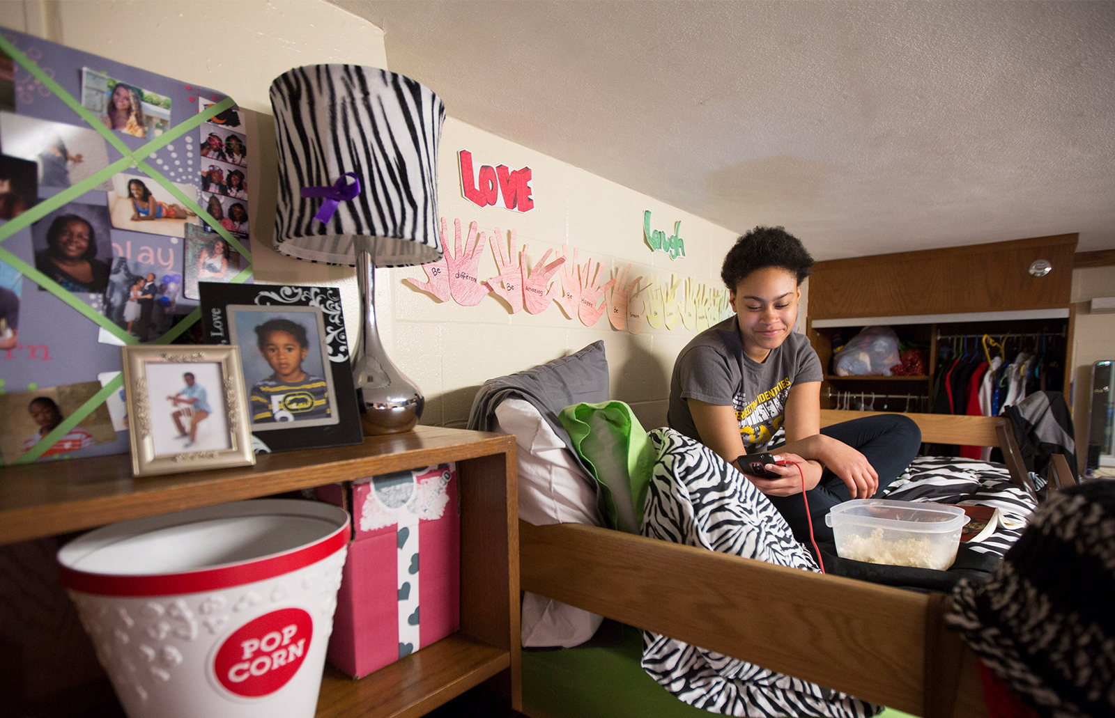 Smiling student in residence hall room
