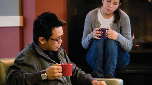 Smiling student in residence hall room