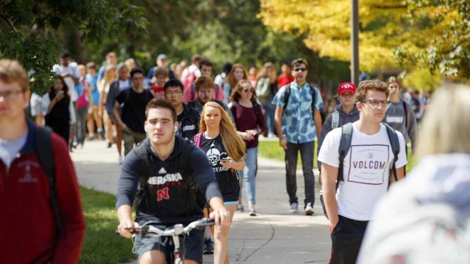 Students cheer at the football game