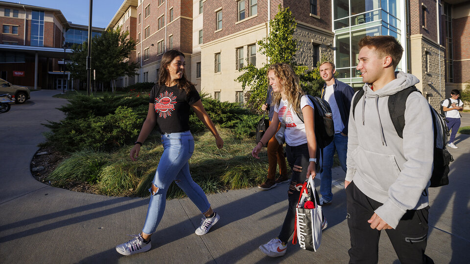 Students in front of a residence hall